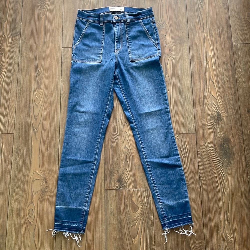 Blue high rise jeans, distressed bottoms